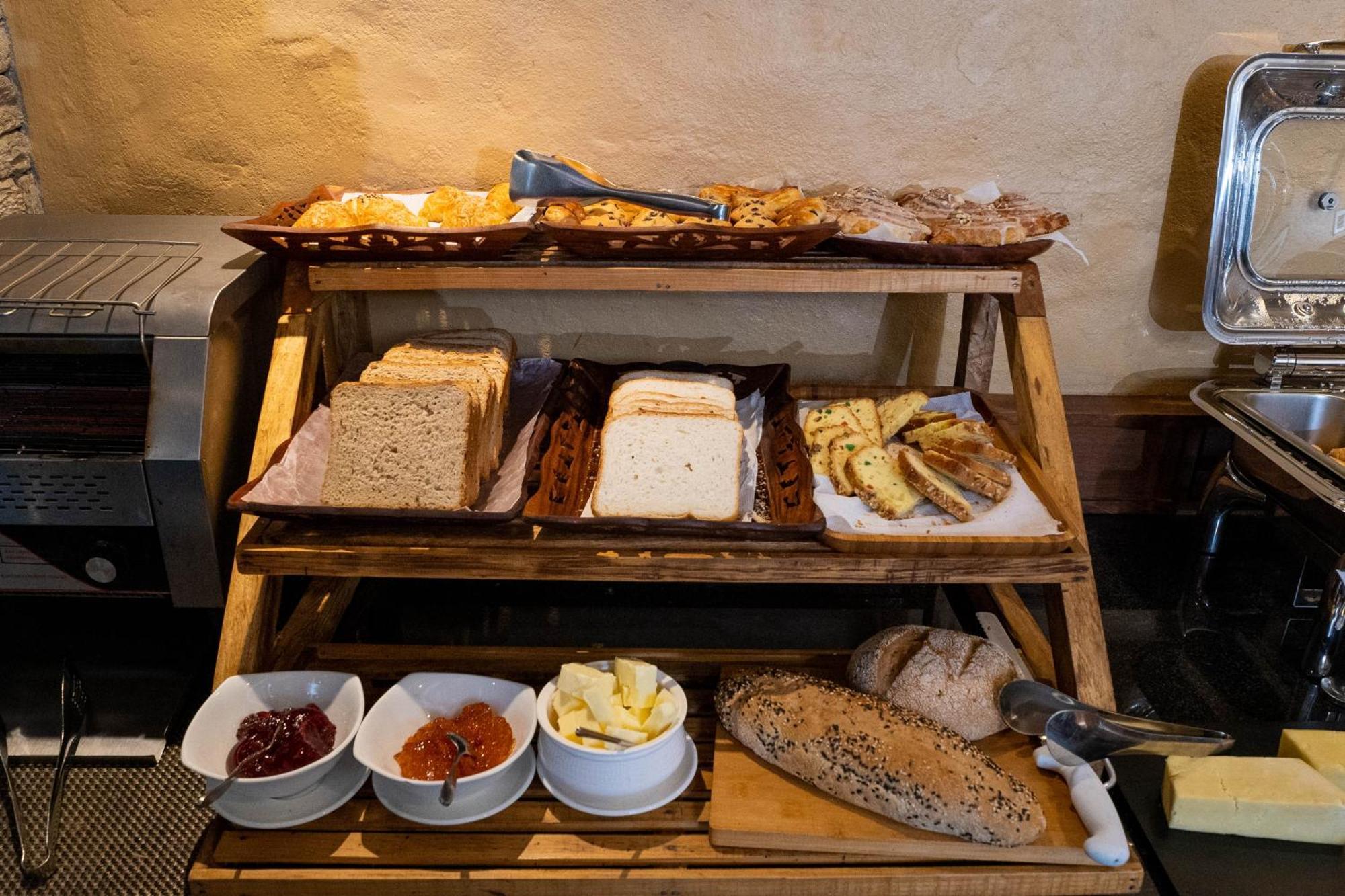 Bar Peepal Resort 포카라 외부 사진 A selection of cheeses at a buffet