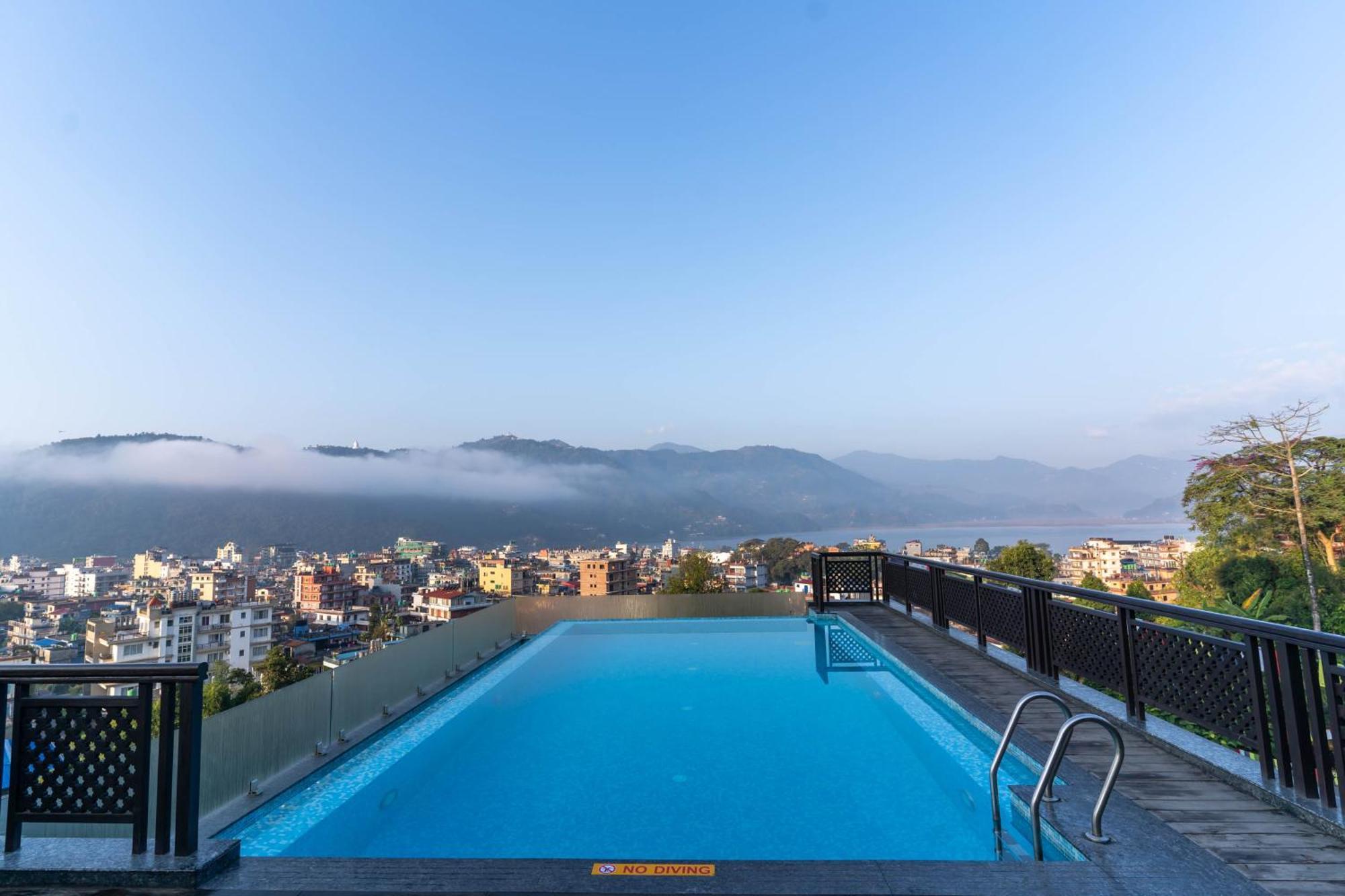 Bar Peepal Resort 포카라 외부 사진 View of the city from the hotel